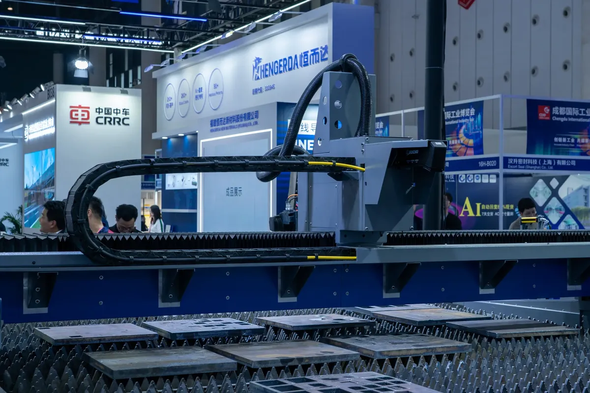 A view of advanced industrial machinery displayed at a trade fair exhibit.